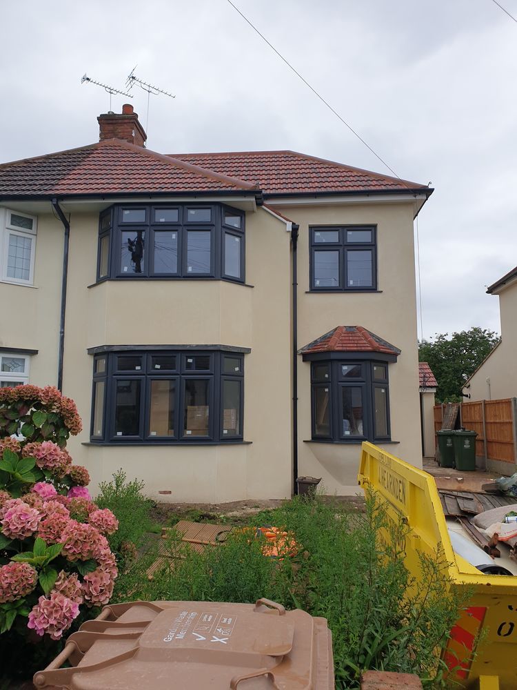 Completed smooth exterior render on a two-storey house